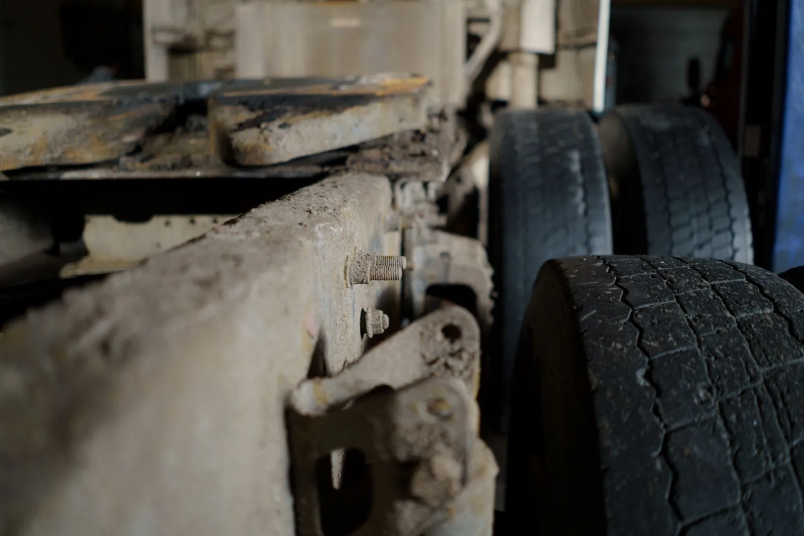 Close detail of a tractor chassis rail and running gear