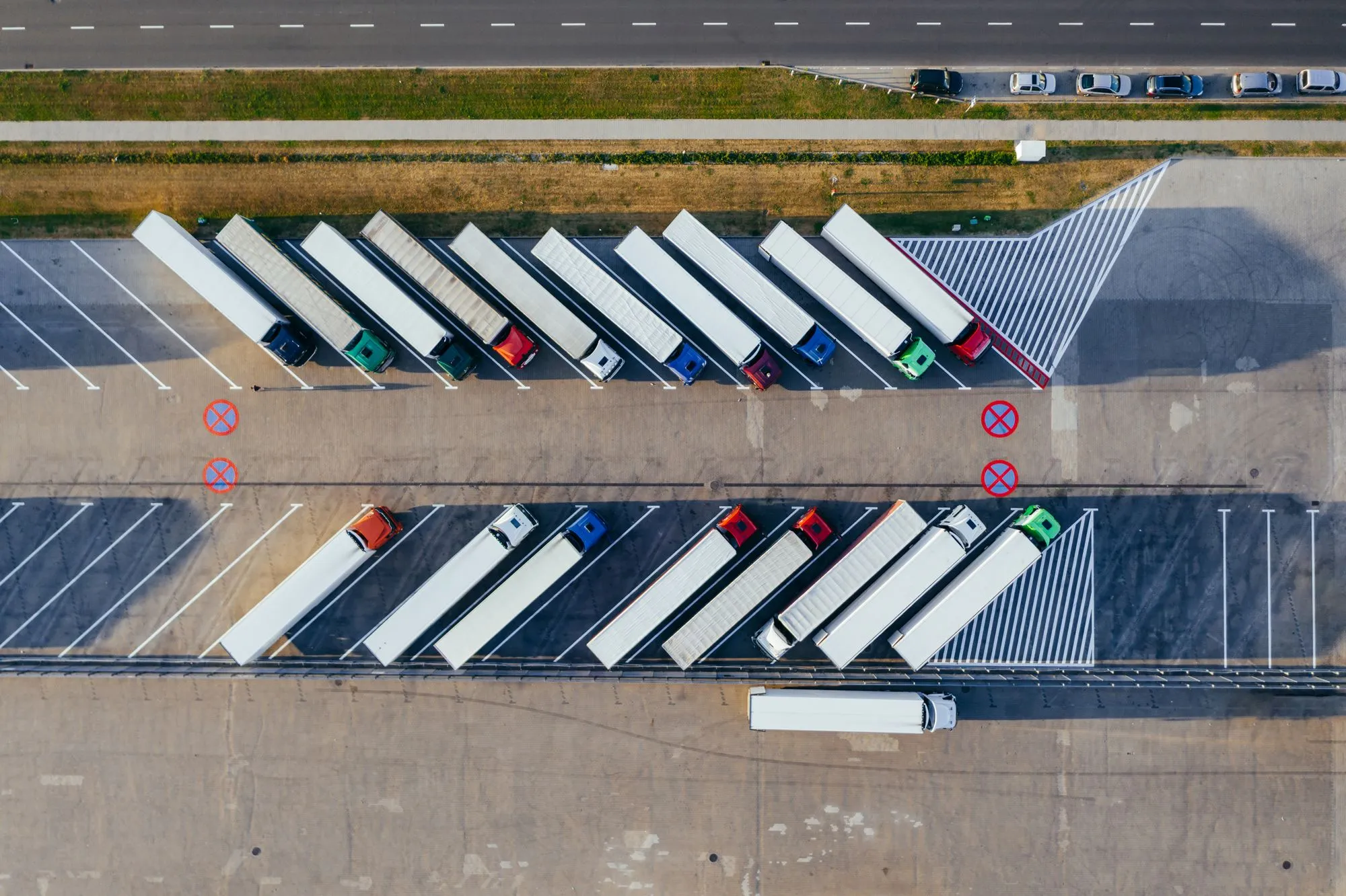 Overhead view of tractor units parked in marked bays